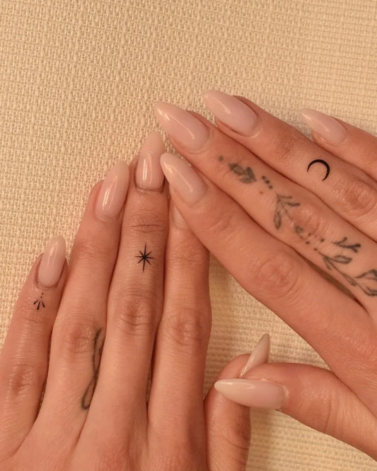 Small Delicate Stars Leaves Moon on Women Fingers Tattoo by @tattooer_jina