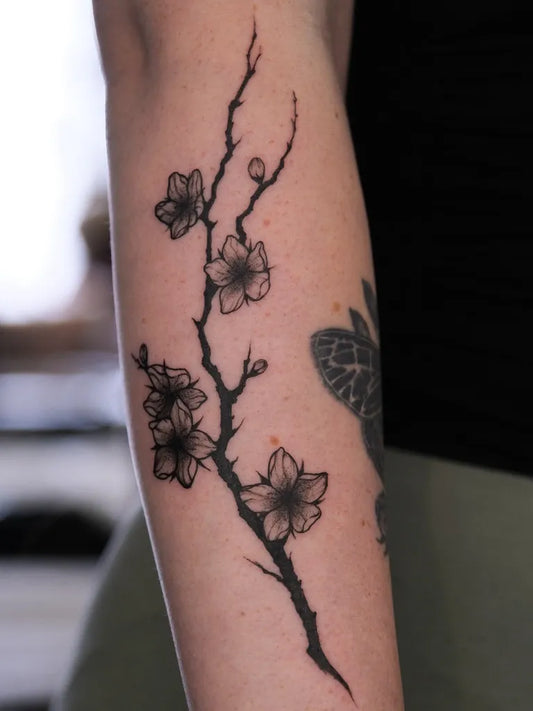 Small Dotwork Cherry Blossom Branch on Women Arm Tattoo by @erikaivanova