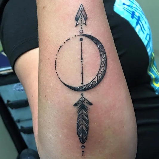 Small Dotwork Crescent Moon and Arrow Tattoo on Women Arm by @luckybambootattoo