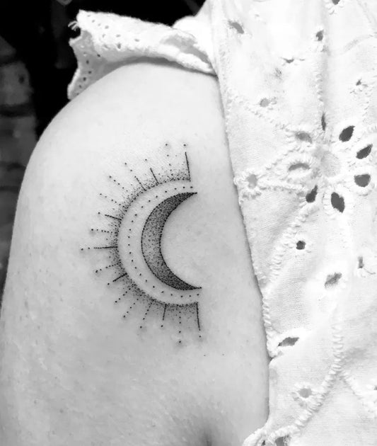 Small Dotwork Crescent Moon and Sun Tattoo on Women Shoulder by @hetty_may