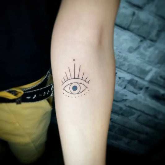 Small Dotwork Evil Eye on Women Arm Tattoo by @emilia_paw_arts