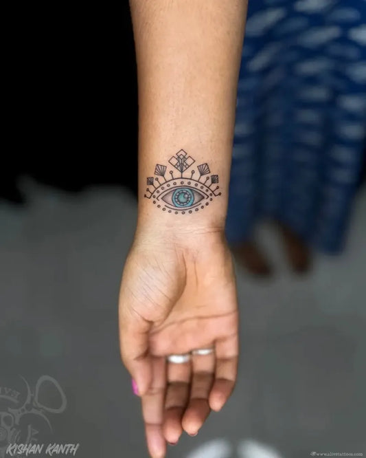 Small Dotwork Evil Eye on Women Wrist Tattoo by @alivetattoos