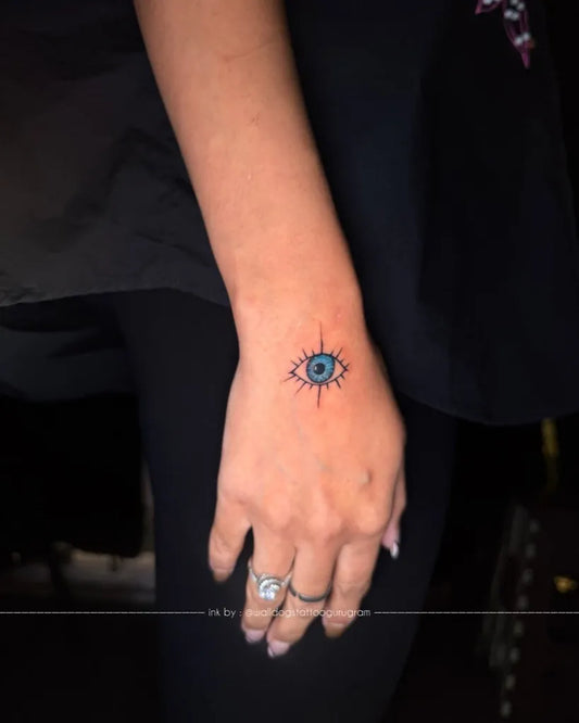 Small Dotwork Evil Eye on Women Wrist Tattoo by @walldogstattoogurugram