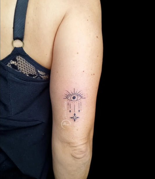 Small Dotwork Evil Eye with Teardrops on Women Arm Tattoo by @taniasantostattoo
