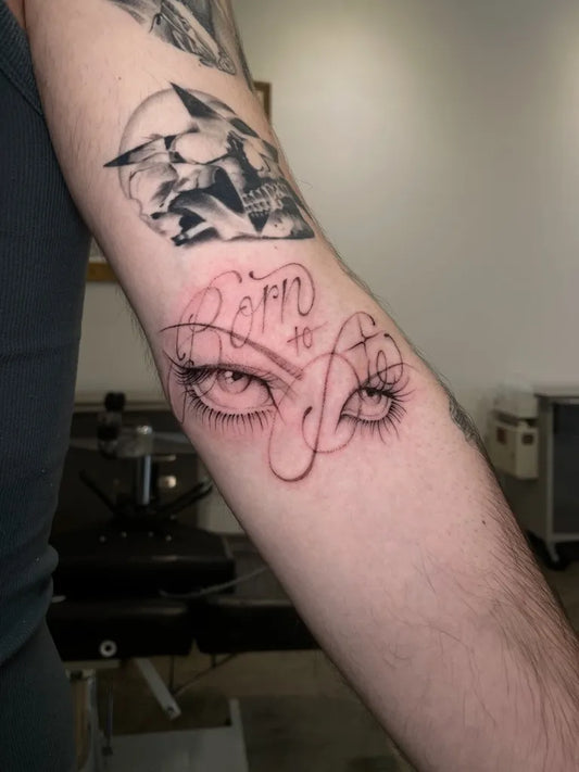 Small Dotwork Eyes Text Tattoo on Men Arm by @raybies.ink