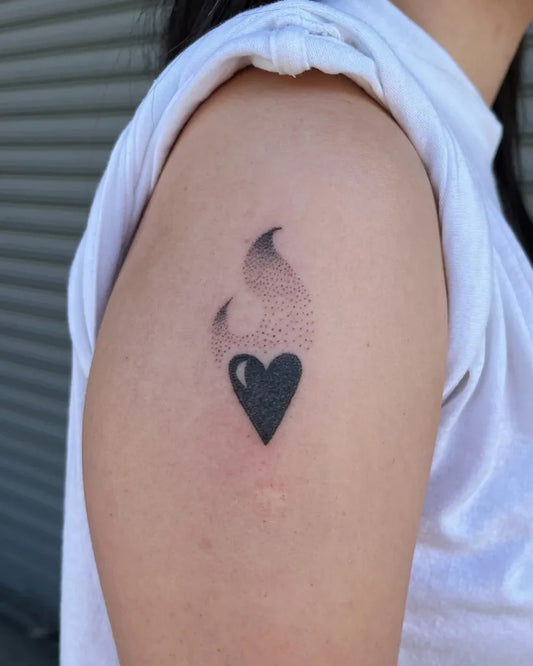 Small Dotwork Flame Heart on Women Upper Arm Tattoo by @ruby.stencil