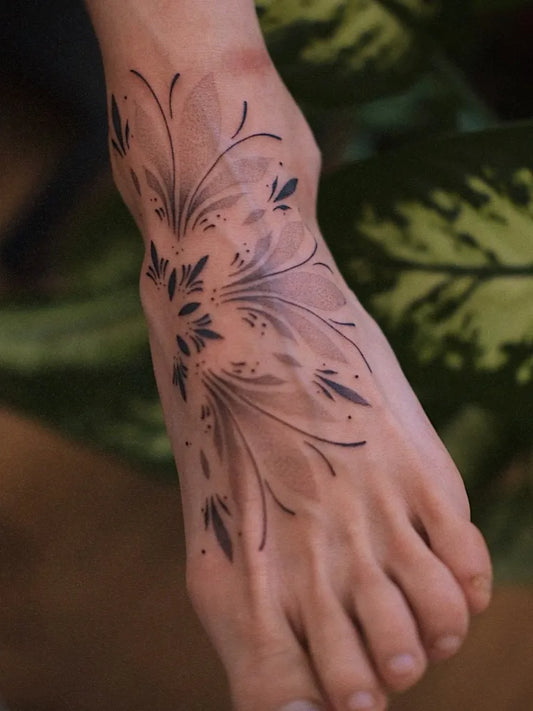 Small Dotwork Floral Design Tattoo on Women Foot by @janka_barkanyi