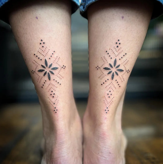 Small Dotwork Floral Motif Tattoo on Women Calf by @indigoforevertattoos