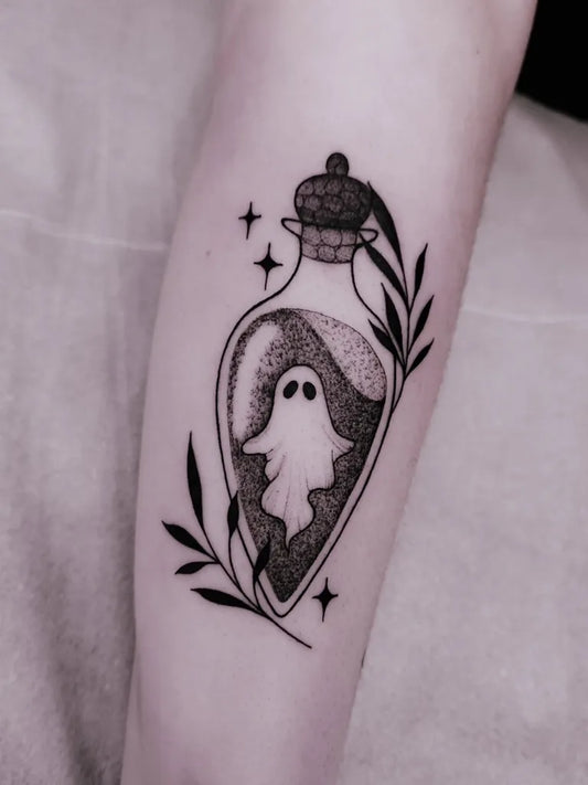 Small Dotwork Ghost in Vial Tattoo on Women Forearm by @vitoriablackink