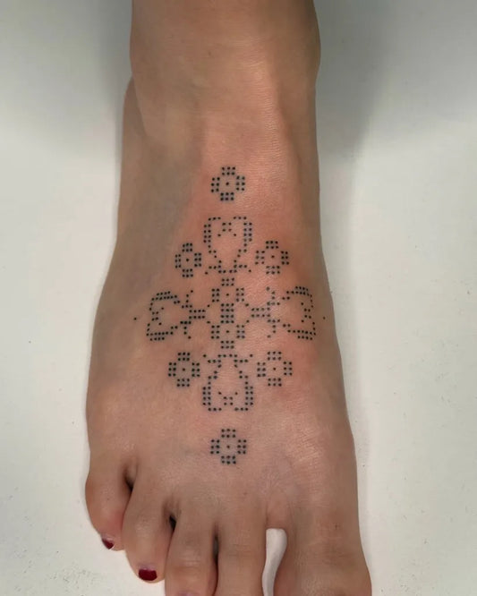 Small Dotwork MandalaTattoo on Women Foot by @savage.sticks