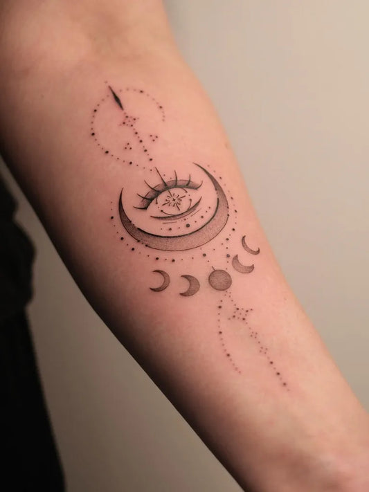Small Dotwork Moon Eye Tattoo on Women Arm by @universewithintattoo