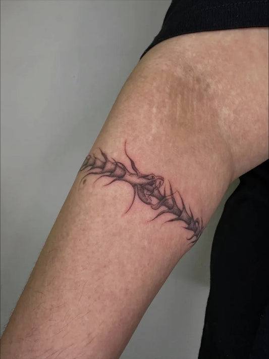 Small Dotwork Ouroboros Tattoo on Women Arm by @dj__peanut