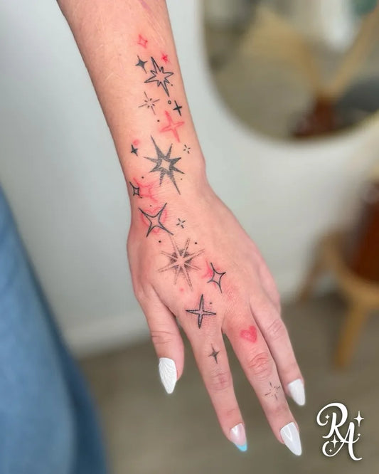Small Dotwork Star Tattoo on Women Wrist by @redancolie.tattoo