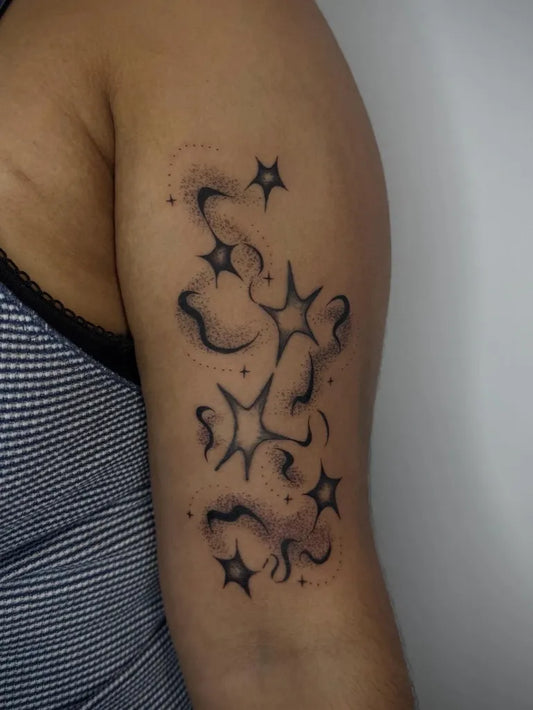 Small Dotwork Star and Swirl Tattoo on Women Arm by @p0melow
