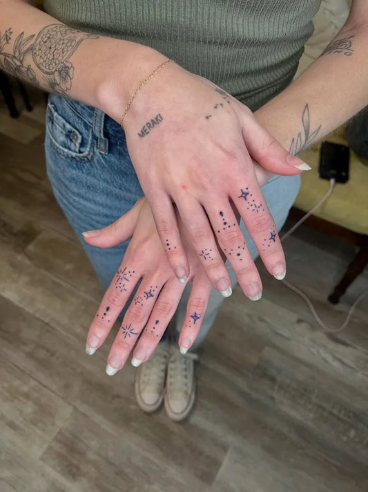 Small Dotwork Stars on Women Fingers Tattoo by @tay.leigh.k