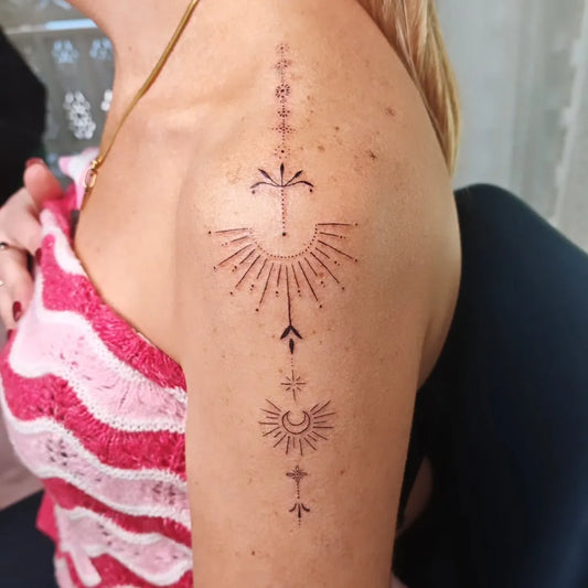 Small Dotwork Sun and Moon Tattoo on Women Shoulder by @sacredtree_ink