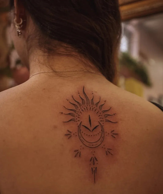 Small Dotwork Sun and Moon on Women Back Tattoo by @taylahjadeart