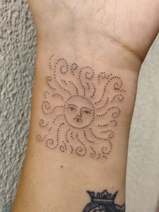 Small Dotwork Sun on Women Wrist Tattoo by @noalavande