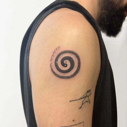 Small Dotwork Yin Yang and Spiral Tattoo on Men Upper Arm by @natpoke.tattoo