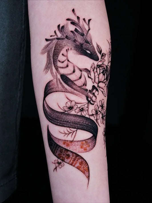 Small Dragon and Floral Design on Women Arm Tattoo by @lsy.ink