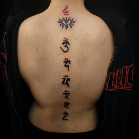 Small Eastern Lotus Mantra on Women Spine Tattoo by @cheyenne_hertz_tattoos