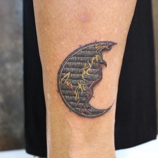 Small Embroidery Crescent Moon Tattoo on Women Leg by @inkfloydtattoo_manresa