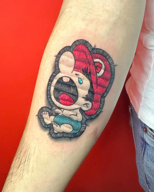 Small Embroidery Crying Baby Mario Tattoo on Men Arm by @skinktattoohouse