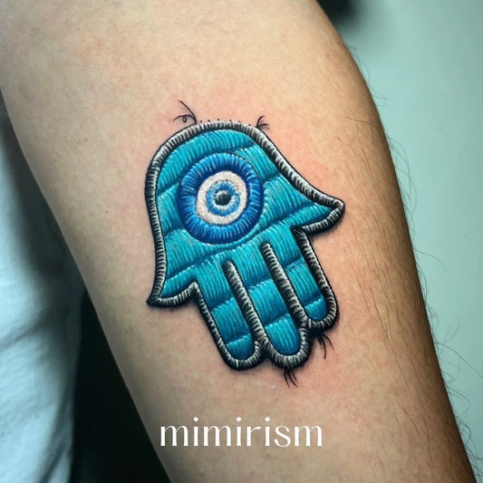 Small Embroidery Hamsa Eye Tattoo on Women Arm by @mimirism