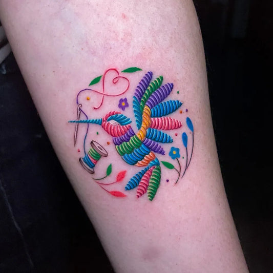 Small Embroidery Hummingbird Thread Spool Tattoo on Women Arm by @alicia_casale