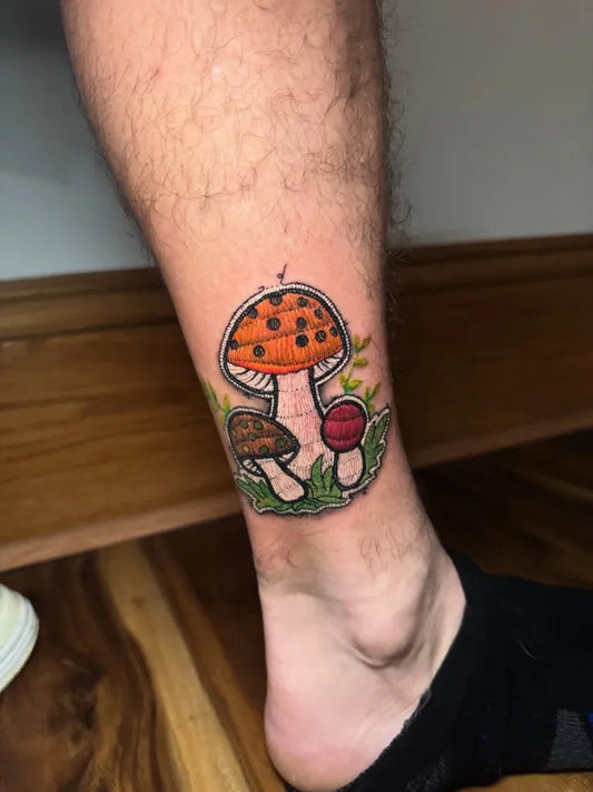 Small Embroidery Mushrooms on Men Leg Tattoo by @diegoconcitattoo