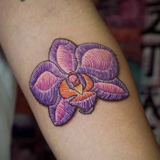 Small Embroidery Purple Orchid Tattoo on Women Arm by @ar2ta2