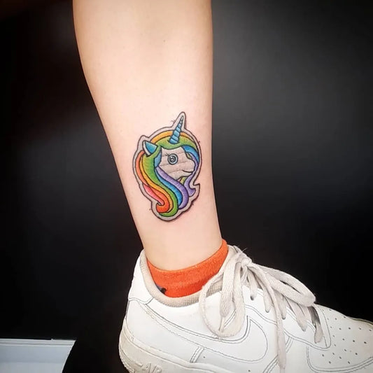 Small Embroidery Rainbow Unicorn Tattoo on Women Ankle by @superqueentattoo