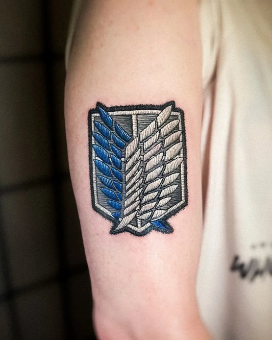 Small Embroidery Survey Corps Wings of Freedom Tattoo on Men Arm by @gyeong_.tt