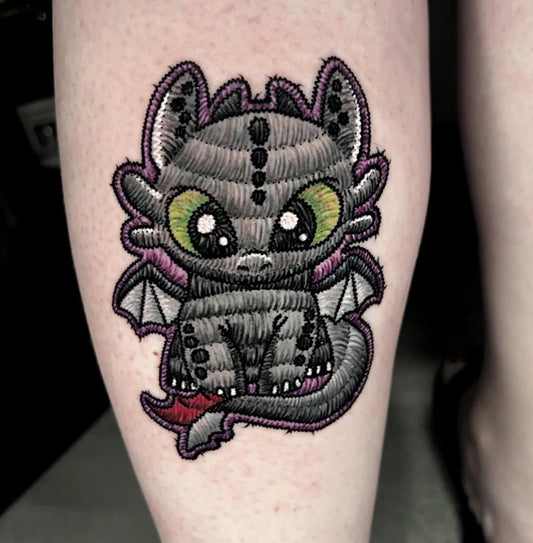 Small Embroidery Toothless Dragon Tattoo on Women Thigh by @marlosalvatierra