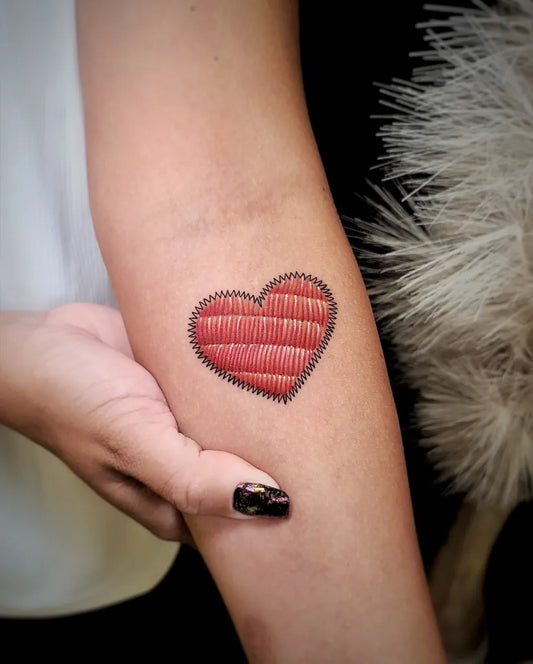 Small Embroidery stitched heart Tattoo on Women arm by @vickyink22