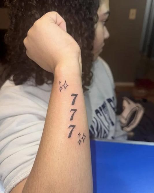 Small Fine Line 777 and Stars Tattoo on Women Wrist by @dulaadula.2x