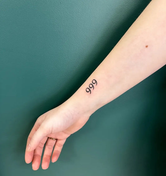 Small Fine Line 999 Tattoo on Women Wrist by @negana_tattoo