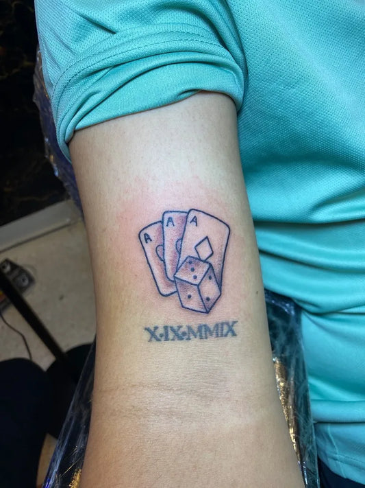 Small Fine Line Aces Dice Tattoo on Women Arm by @abotattooart