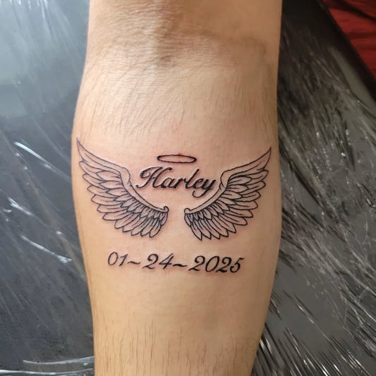 Small Fine Line Angel Wings Harley Tattoo on Women Forearm by @inkedbysavvy