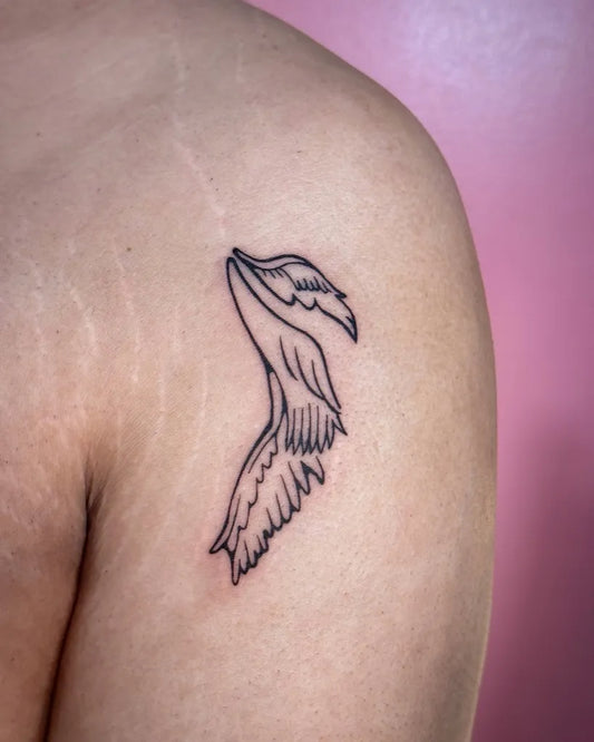 Small Fine Line Angel Wings Tattoo on Men Shoulder by @cleanbean.inks