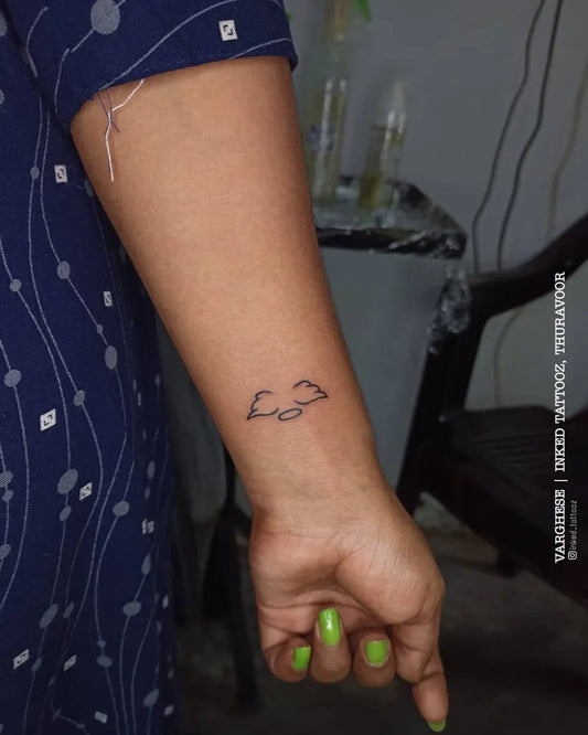 Small Fine Line Angel Wings Tattoo on Women Wrist by @inked_tattooz