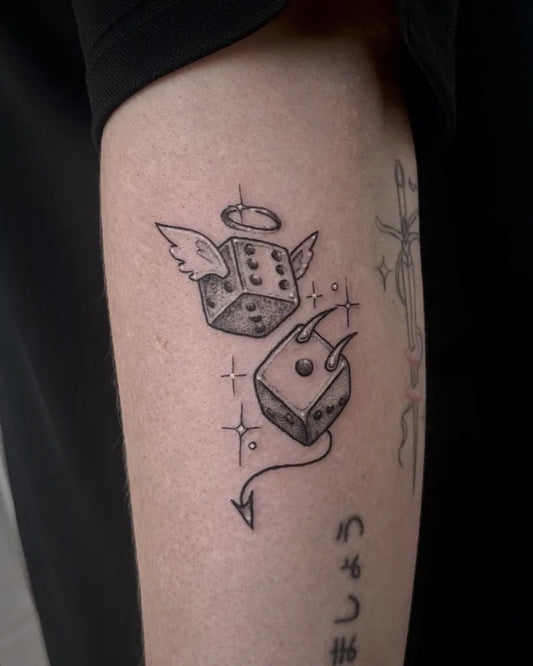 Small Fine Line Angel and Devil Dice Tattoo on Men Arm by @lexorcisttattoo