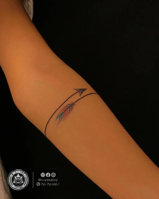 Small Fine Line Arrow Tattoo on Women Arm by @m.ainktattooz