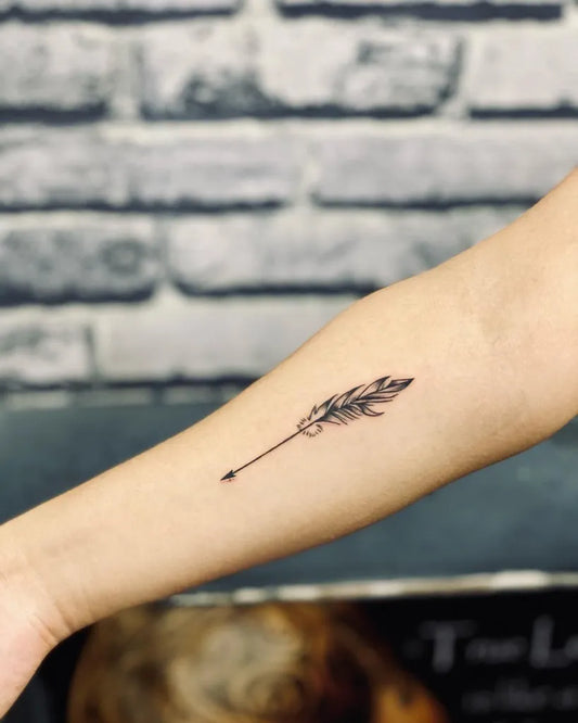 Small Fine Line Arrow Tattoo on Women Forearm by @angeltattoostudiogoa