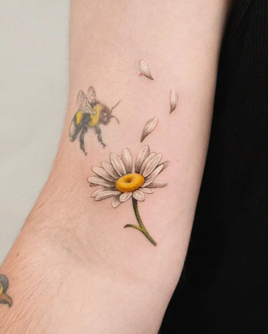 Small Fine Line Bee and Daisy Tattoo on Women Arm by @zihong_tattoo
