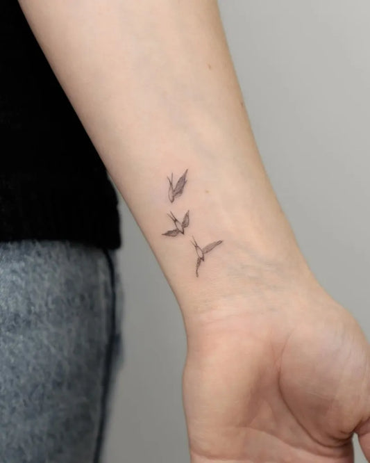 Small Fine Line Birds Tattoo on Women Forearm by @vladkork