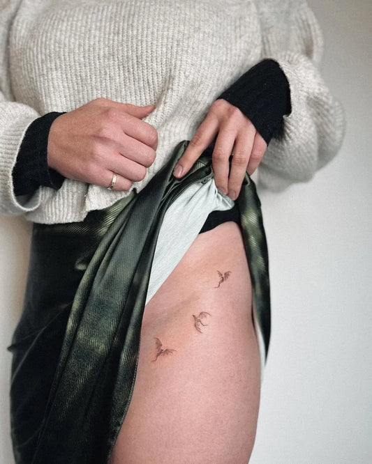 Small Fine Line Birds Tattoo on Women Hip by @sorcha.elspeth.tattoo
