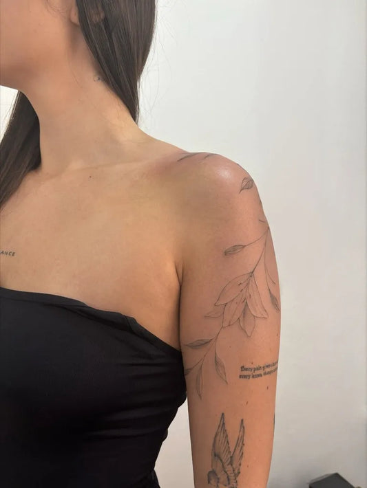 Small Fine Line Branch with Leaves and Dove on Women Shoulder Leaves Tattoo by @nancy_ded