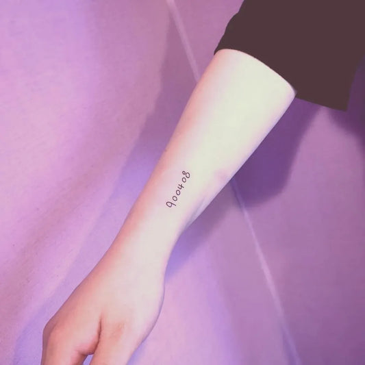 Small Fine Line Burmese Script Number Tattoo on Women Forearm by @yoyo.tarot
