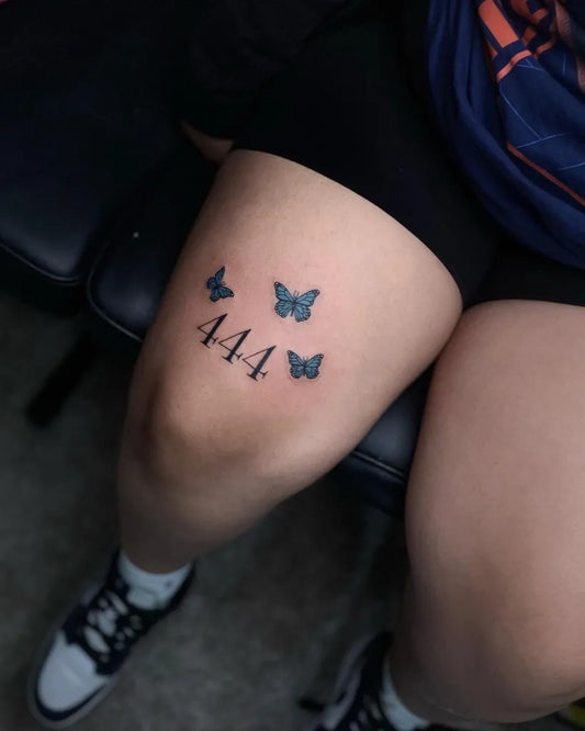 Small Fine Line Butterflies and 444 on Women Thigh Tattoo by @moneyink713